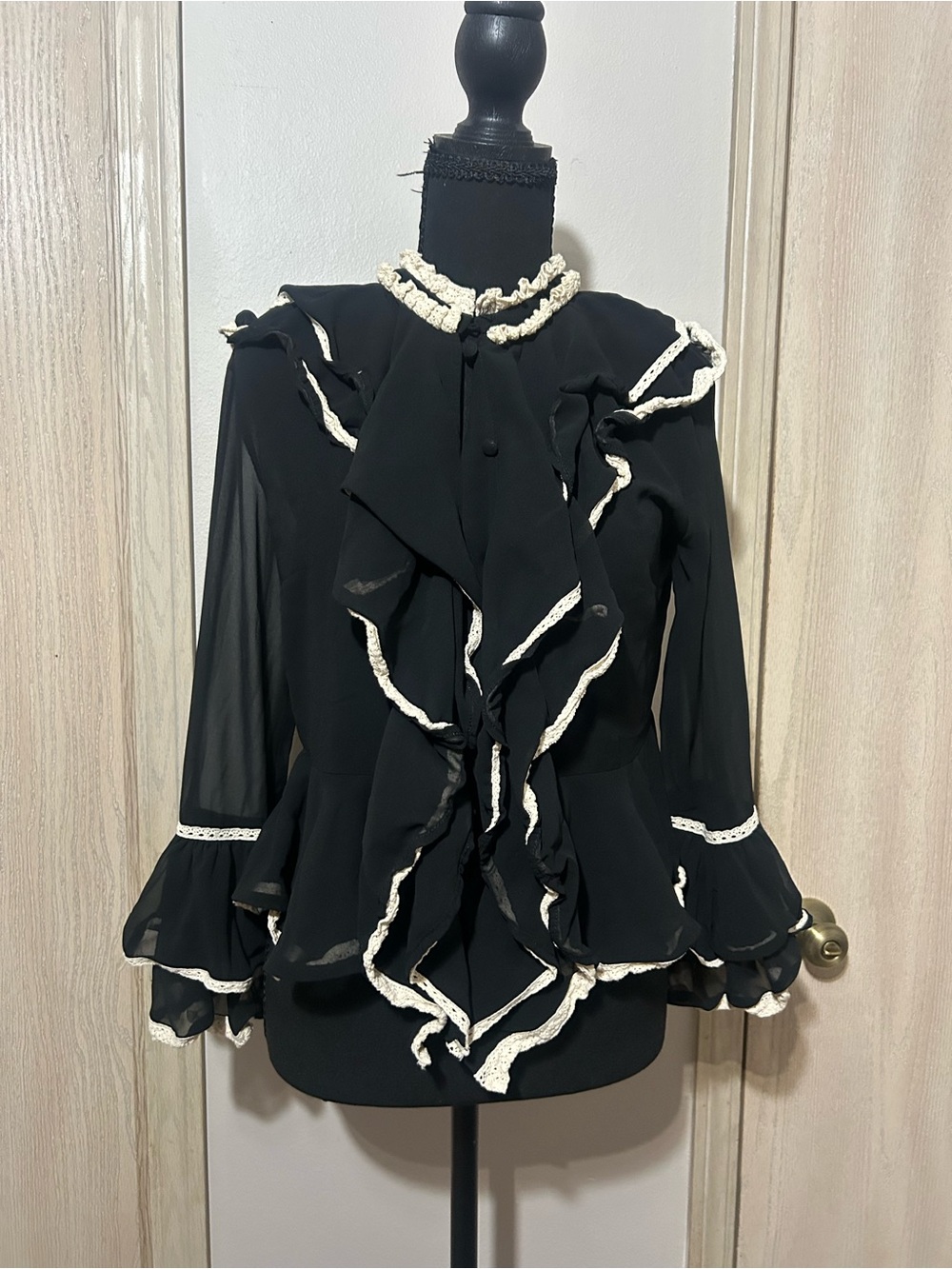 Black Ruffle Tie-Neck Blouse with Cream Trim by